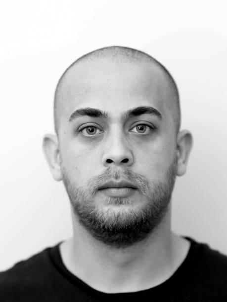 istock Portrait of a handsome young man looking serious 1320565174