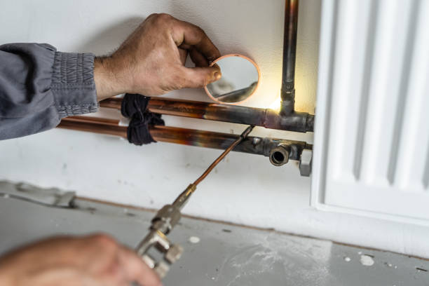 istock Close up on hands Unknown industrial worker plumber with central heating copper pipes welding using gas torch or blowtorch on the wall in house building or apartment - real people at work copy space 1320565919