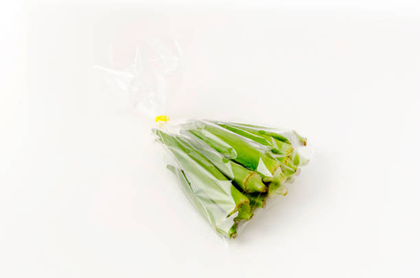 istock fresh Okra in plastic bag on white background 1320568403
