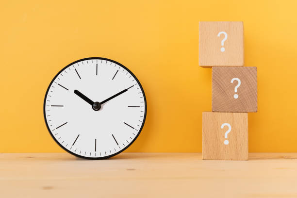 Time; Wooden blocks with question mark and a clock.