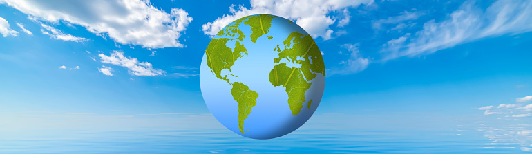 World Environment Day Climate change. The green planet Earth has the texture of a leaf. Background with sky, clouds and blue ocean