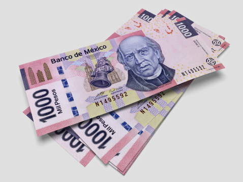 3D render of one thousand pesos bills with sharp focus.