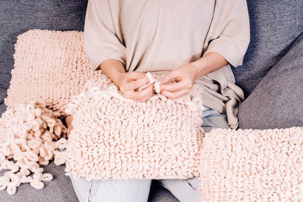 istock Knits made from thick soft yarn. Soft knitted cushions made of thick yarn. 1320577352