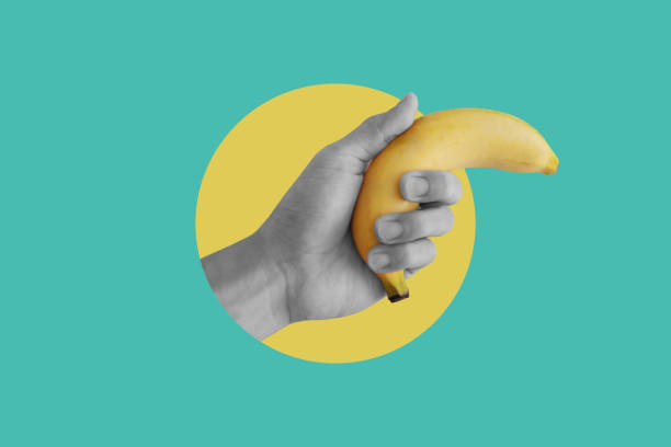 istock Digital collage modern art. Hand holding banana 1320590918