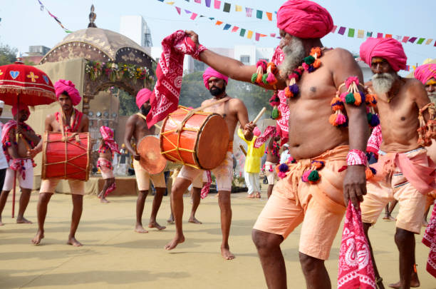 Traditional tribal folk dance and music being performed at Bhimthadi festival, Pune, Indi Traditional tribal folk dance and music being performed at Bhimthadi festival, Pune, India ceremonial dancing stock pictures, royalty-free photos & images