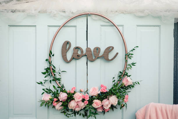Floral love decoration as wedding reception backdrop