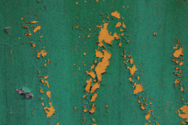 Old rusty galvanized fence, peeled paint, multicolored