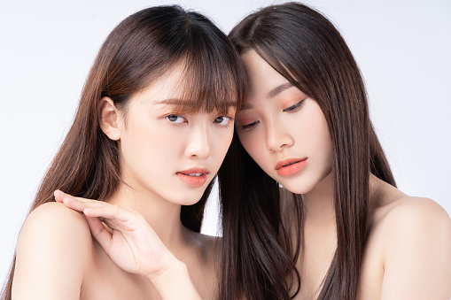 Beauty portrait of two beautiful young Asian girls