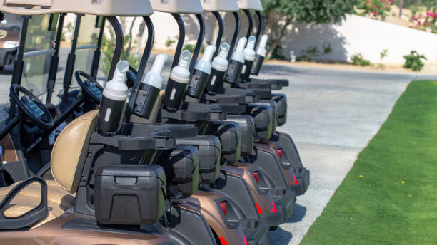 istock A row of electric golf carts on a golf course. 1320603436