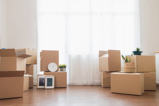 istock Cardboard boxes placed in containers for moving into the new home. copy space 1320604185