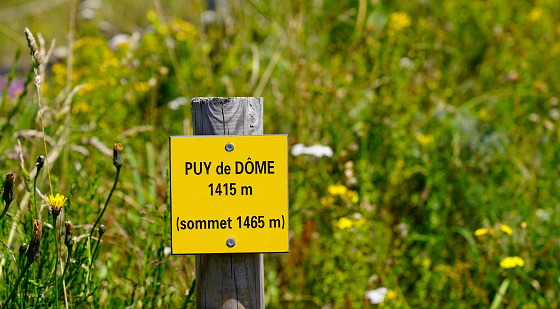 indicative sign at the top of the mountain indicating the altitude of the summit at 1465 meters of Puy de dome