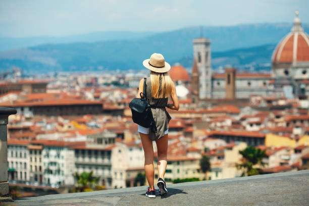 istock Girl tourist exploring new city 1320612841