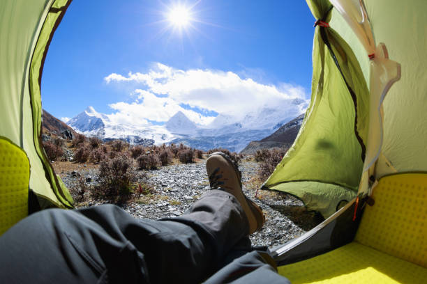 istock Hiker enjoy the beautiful landscape in tent 1320612959