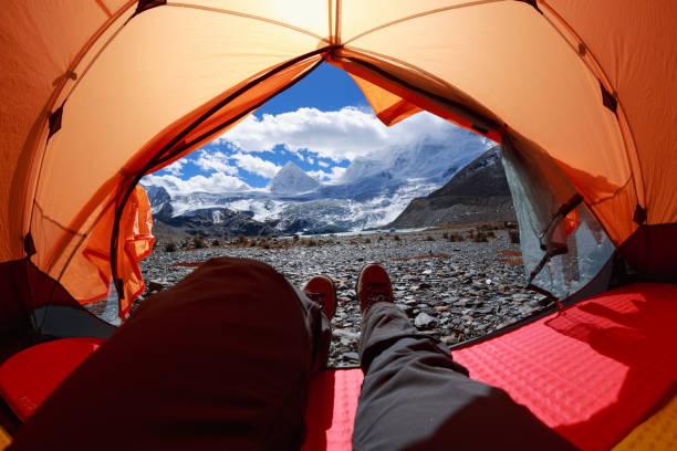 istock Hiker enjoy the beautiful landscape in tent 1320613133