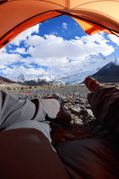 istock Two hikers enjoy the beautiful landscape in tent 1320613228