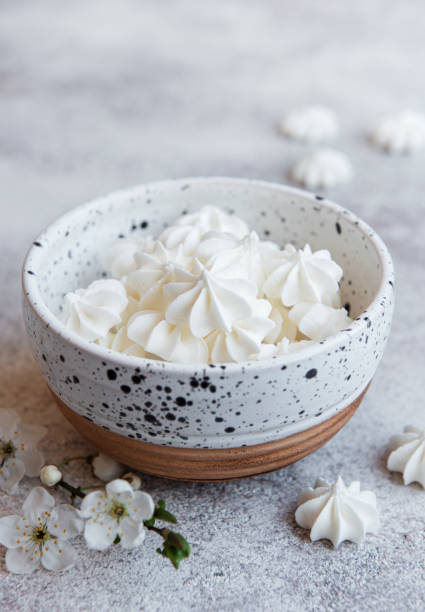 Small white meringues in the  ceramic bowl