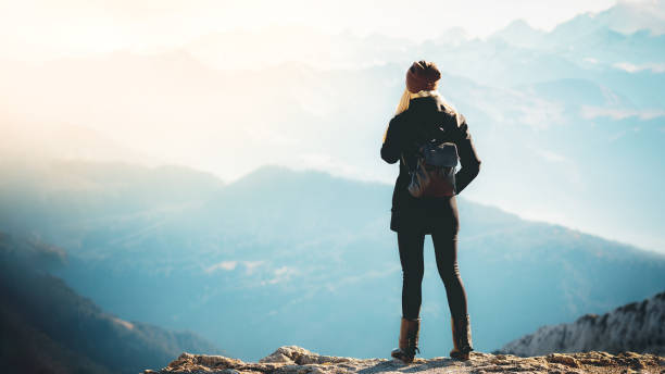 istock Girl tourist exploring mountains 1320614263