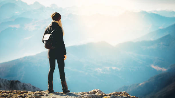 istock Girl tourist exploring mountains 1320614288