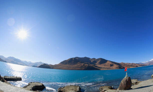 Yamdrok lake in tibet china(words on stone means the name of Yamdrok lake  and it’s altimeter)