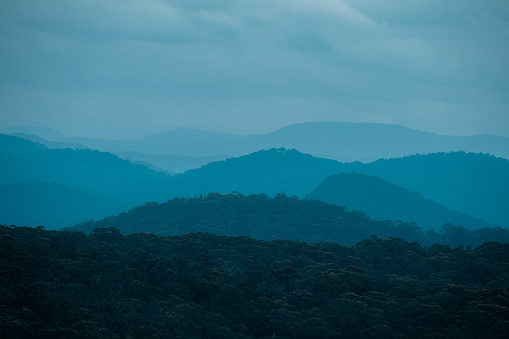 These mountains are in the state of NSW in Australia and often look blue as seen here when in the mist and early evening.