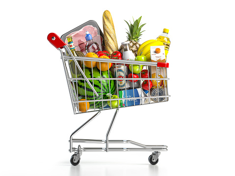 Carro de la compra lleno de comida aislada sobre blanco. Concepto de tienda de comestibles y alimentos. photo