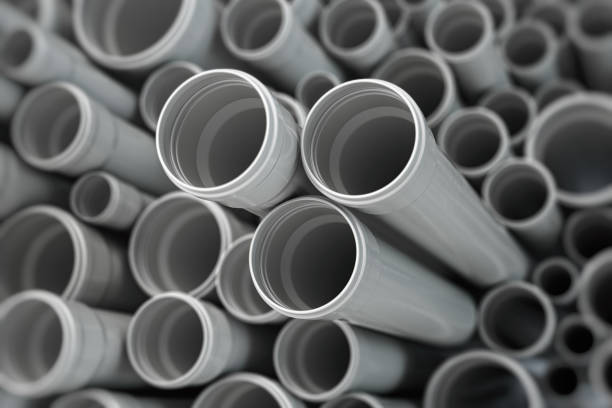istock PVC plastic pipes and tubes background. 1320617362