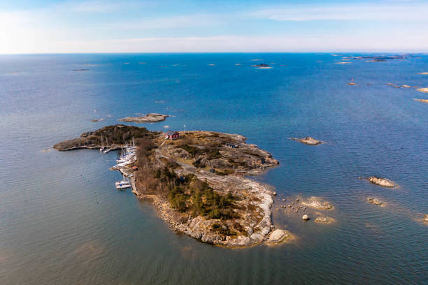 istock Small island with a sailboat harbor in Finland 1320617421