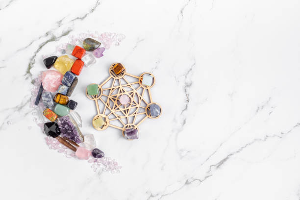 istock Healing chakra crystal grid therapy. Rituals with gemstones and aromatherapy for wellness, healing, meditation 1320619350