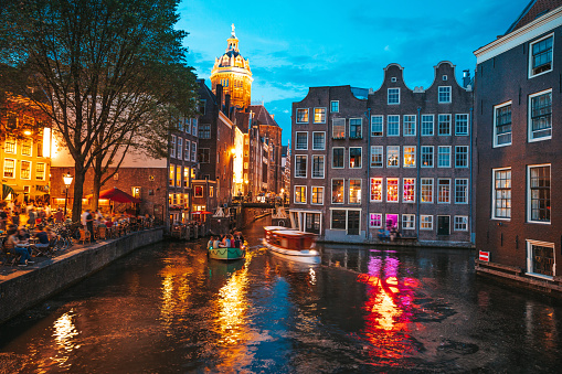 Amsterdam canals and bridges illuminated at night