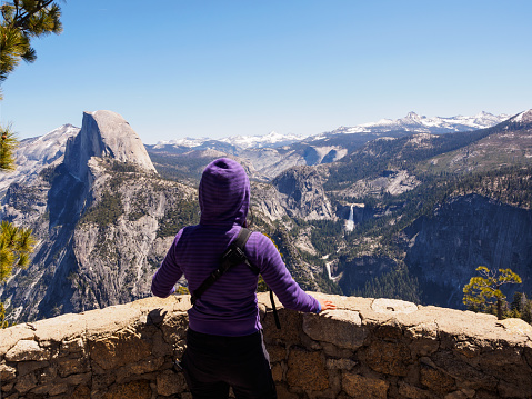 Woman enjoying the Glacier Point view in the Yosemite National Park