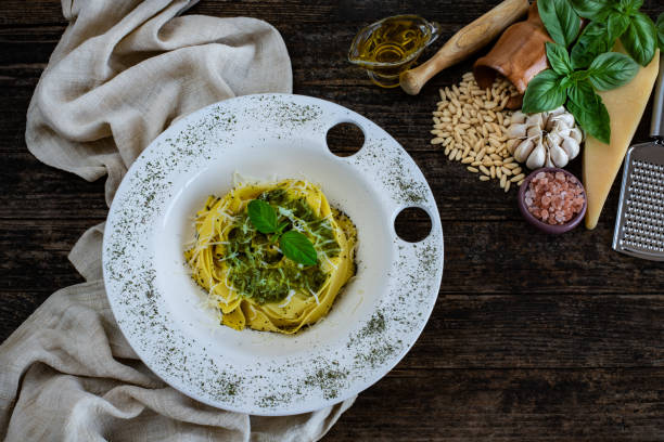 istock Preparing pesto sauce with parmesan cheese, basil, pine nuts and other ingredients. 1320620711