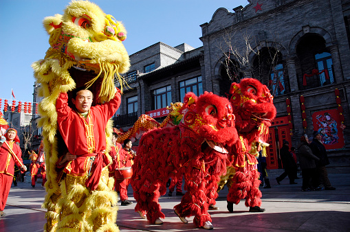 BeiJing, China - January 30th, 2011: A lion dance is being performed in the main street of qianmen street in BeiJing to celebrate the Chinese New Year.