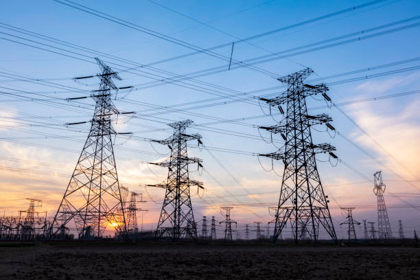 istock Pylons, high voltage pylons in the evening 1320622914