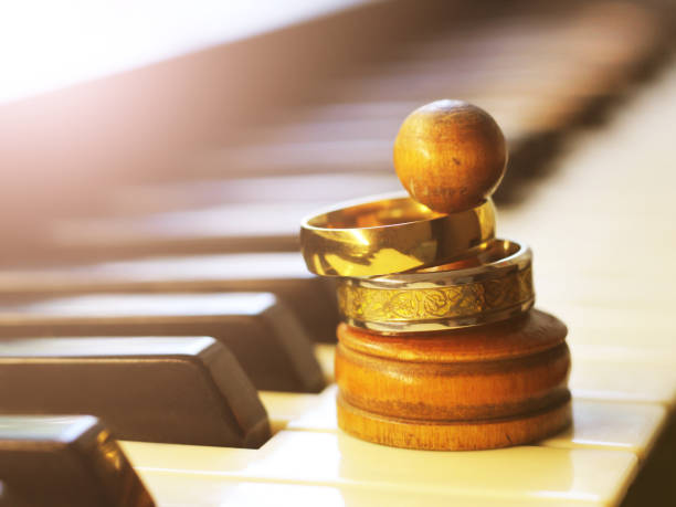 istock wedding rings on a chess figure, piano keys 1320622919