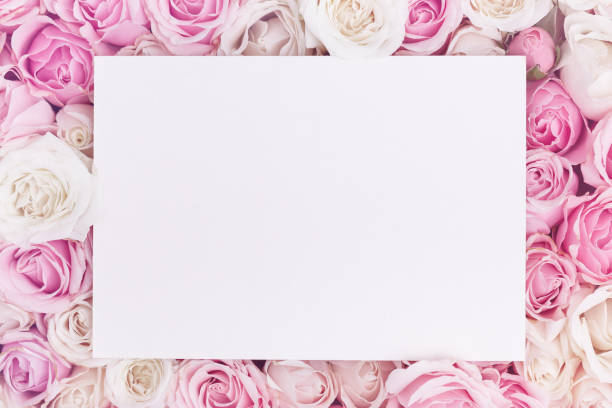 istock Paper card mockup on romantic roses background with copy space 1320623778