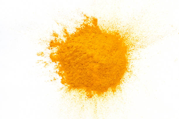 istock Dry organic turmeric powder pile on white background 1320625197