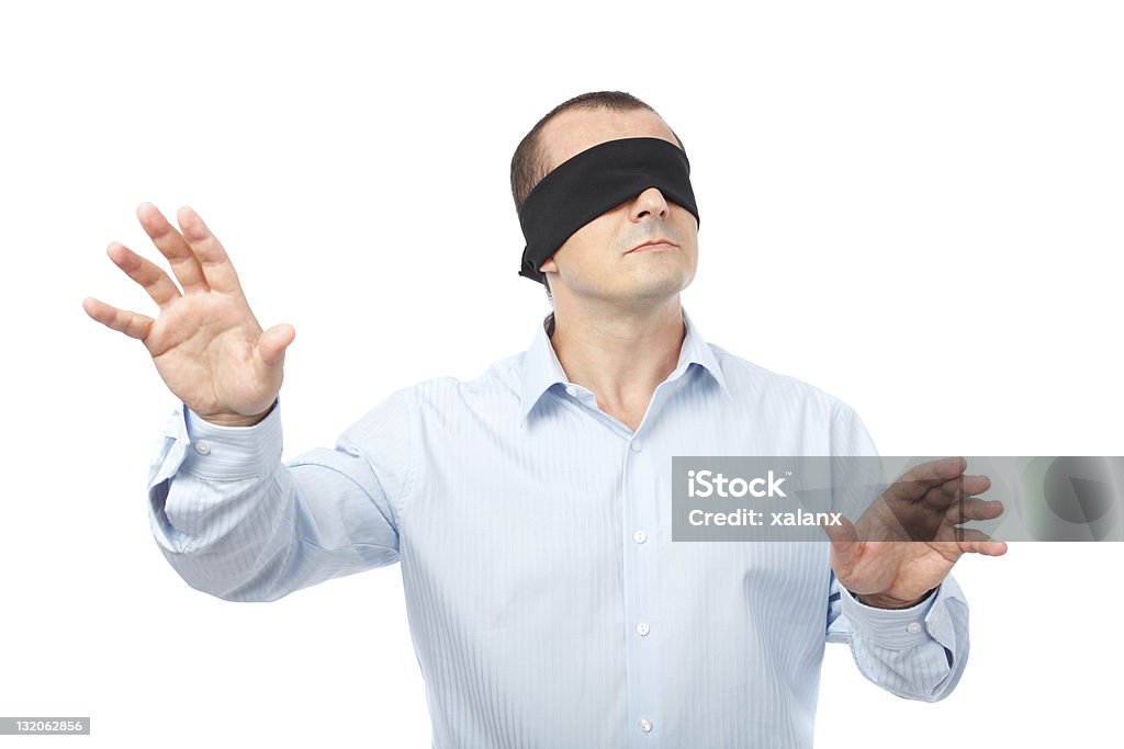 Blindfolded businessman Businessman blindfolded stretching his arms out, isolated on white background Blindfold Stock Photo