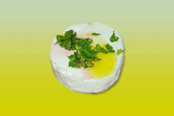 istock tomino cheese with olive oil and parsley 1320628770