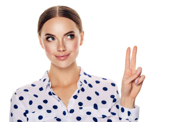 istock Beautiful girl with peace sign 1320630350