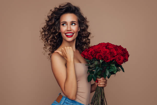 istock Beautiful woman with flowers 1320631522
