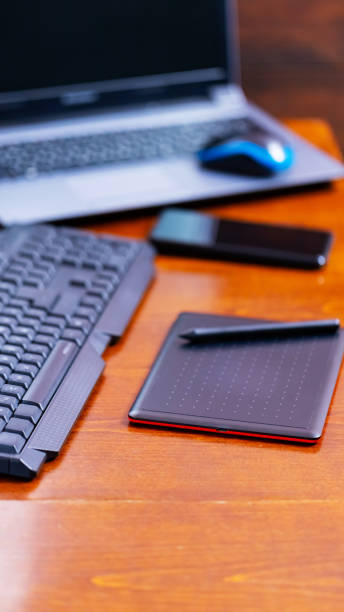istock Remote work graphic designer. Freelancer workplace. Laptop, smartphone and graphic tablet in the workplace 1320631752