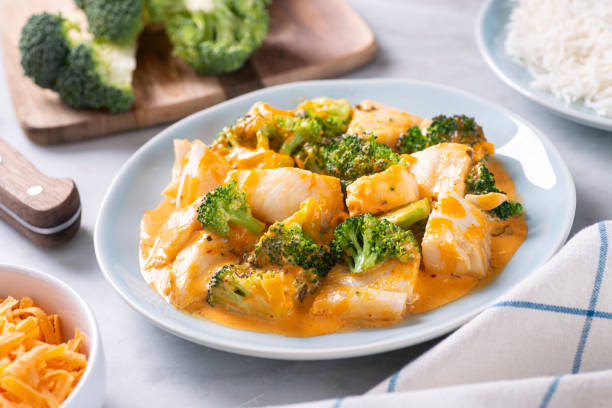 istock Oven Baked Fish with Broccoli and Cheese 1320634988