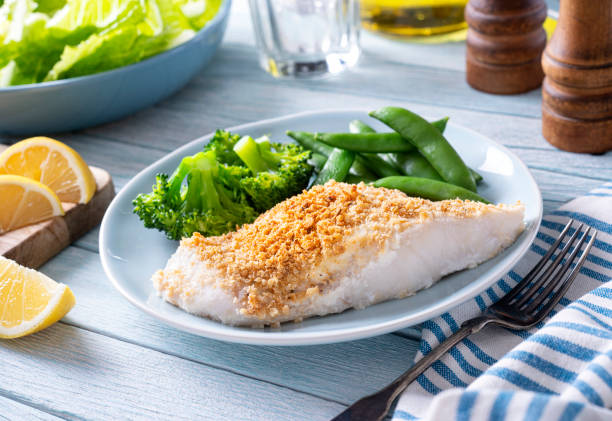 istock Oven Baked Fish with Crumbled Cracker Crust 1320635052