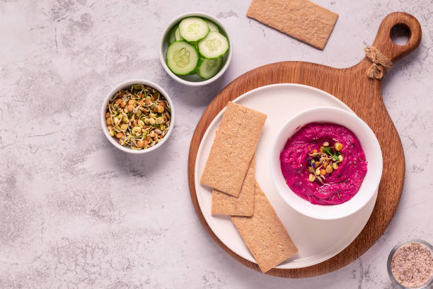 istock Roasted Beet Hummus with sprouted grains, cucumber and crispbread 1320635652