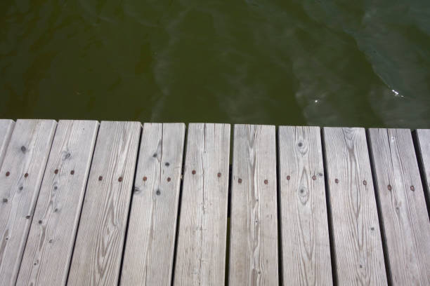 Three Kayaks awaiting Launch on Dock