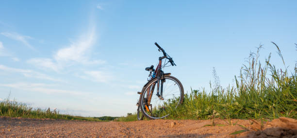 istock Single bike next to dirt road 1320637891