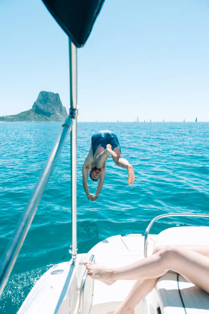 istock Man diving to the sea from boat 1320637973