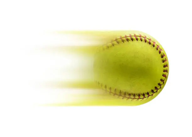 Photo of Full speed. Yellow softball ball isolated on white background.