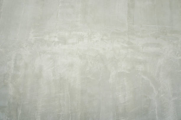 istock White stucco wall background. White painted cement wall texture cement floor vintage 1320640757
