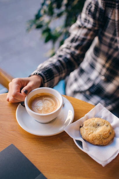 istock Coffee espresso holding girl 1320643560
